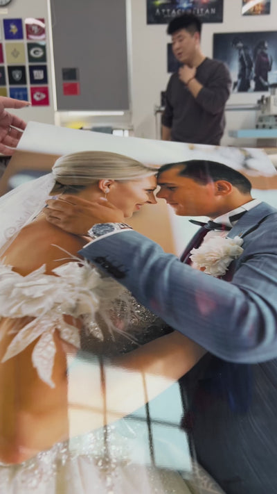 Personalized metal photo print of a wedding couple, hanging on a living room wall